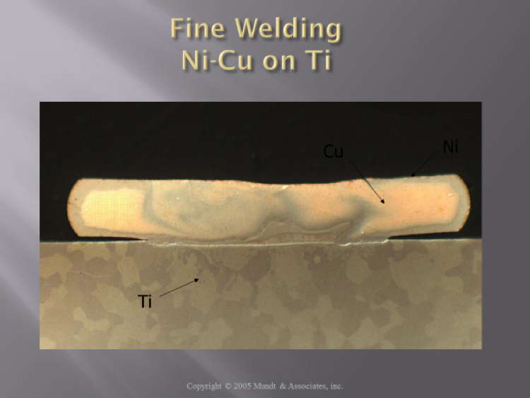 Example of a typical laser bond with a strong but shallow weld of Nickel-Copper to Titanium. Very strong bonds are achieved even at weld depths of less than 1 micron.